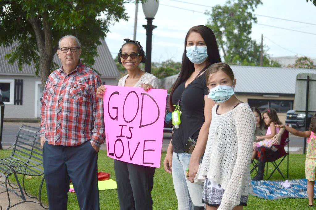There was a peaceful protest at the Wood County Courthouse Monday morning attended by several local citizens. Pictured are (left to right) Vernon Olmsted (Bohannon’s grandfather), Kimberly Bohannon (protest organizer), Ashley Lance and Milo Reed.